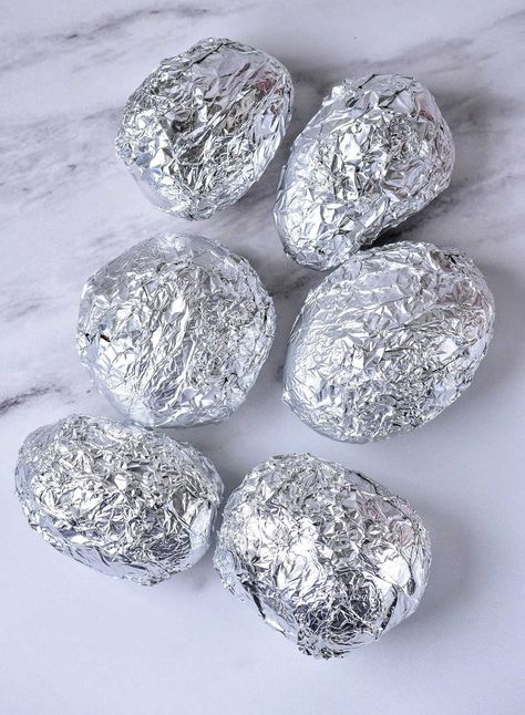 This is how long to bake potatoes at 375 in foil so the insides are fluffy and how to make baked potato skins crispy when done too. Whole Potatoes In Oven, Baked Potatoes In Foil In The Oven, Oven Baked Potato In Foil, How To Bake A Potato In The Oven In Foil, Oven Baked Potatoes In Foil, Baked Potatoes In The Oven With Foil, Easy Baked Potato In Oven, How To Make Baked Potatoes In The Oven, How To Bake Potatoes In Oven