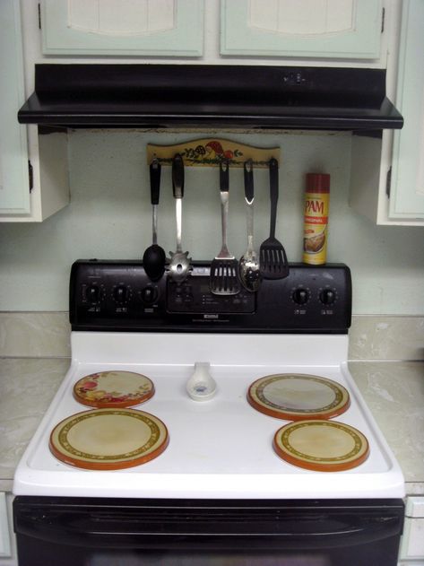 How to install an over the range microwave oven. Installing a microwave isn't difficult, but here are some tips for potential problems and their solutions. Over The Stove Microwave, Over The Range Microwave, Shelf Diy, Cooking Pumpkin, Range Microwave, Cooking Supplies, Ladder Shelf, Cooking Equipment, Diy House Projects