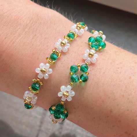 These handmade beaded bracelets feature white flowers with green crystal accent beads. They can be purchased separetly or as a set! Sizing: Different sizes are available. Size small fits wrists 6.5-8.5 inches, and size medium fits wrists 7.5-9.5 inches, add .5 of an inch if you prefer a looser fit. If you need a different size feel free to message me, I can make any size!  Materials: I use glass seed beads and 18k gold plated clasps/ chains. It is not recommended to wear these bracelets when you Beaded Flower Bracelet, Seed Bead Bracelets Tutorials, Sleep Exercise, Bracelet Emerald, Bracelet Matching, Emerald Crystal, Daisy Bracelet, Beaded Bracelets Tutorial, Seed Bead Bracelet