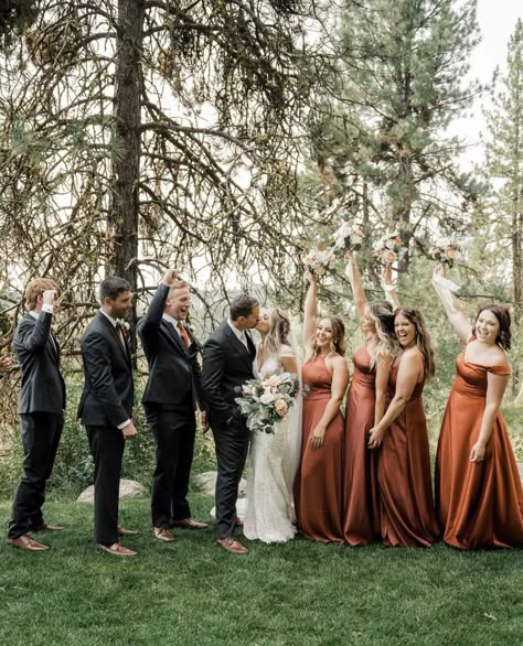 Wedding Party Photos Terracotta, Earth Tone Wedding Groom, Rosewood Bridal Party, Gray Suit With Terracotta Tie, Black And Terracotta Groomsmen, Sage Green And Terracotta Bridal Party, Black Suit Copper Tie, Bronze Bridesmaid Dresses With Groomsmen, Black Suit Fall Wedding