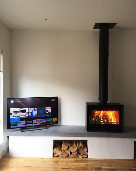 For a perfect entertainment unit, you'll need a TV and a woodburning stove.  📸: @flamebydesignireland Tv Woodburner, Tv And Stove Wall Ideas, Modern Log Burners, Wood Burning Stove Corner, Bali Living, Wood Burning Stoves Living Room, Log Burner Living Room, Modern Wood Burning Stoves, Standing Fireplace