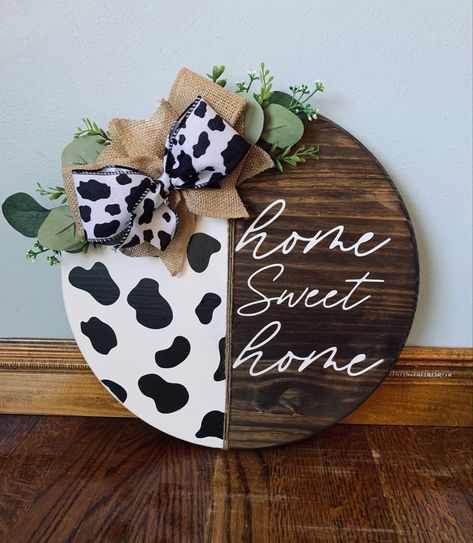 This is a 15 inch cow print themed door hanger, can be customized and made in a 18 inch as well, now available in my etsy shop⭐️ #decor #tiktok #cowprint #pinterest #doorhanger #doorwreath #farmhouse #homesweethome #rustic #etsy #etsyshop #etsyseller #custom #decor Cow Print Decor, Cow Print Door, Teacher Door Hangers, Painting Glass Jars, Round Door Hanger, Door Hangers Diy, Door Crafts, Wooden Signs Diy, Door Signs Diy