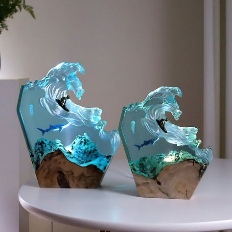 Introducing our stunning Ocean Wave LED Lamp featuring a surfer and a shark, handcrafted from epoxy resin and wood. This mesmerizing marine biology-inspired night light creates a warm, inviting glow, perfect for any bedroom, living room, or office decor. The intricate details of the shark and surfer bring the ocean to life, making it an ideal beach lover gift for him, her, dad, or any ocean enthusiast. Crafted with love and attention to detail, this unique and rustic lamp is made from high-quali Biology Bedroom, Marine Room Decor, Ocean Themed House, Ocean Themed Bedroom For Teens, Ocean Furniture, Ocean House Decor, Ocean Office, Ocean Decor Bedroom, Wave Lamp