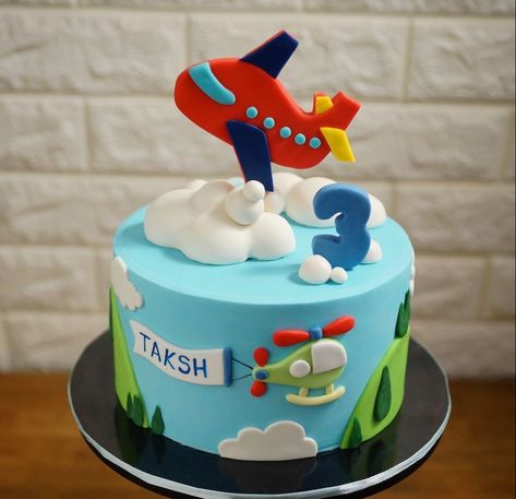 If your kid enjoys scaling new heights, then this unique cake design is for you. This unique aeroplane cake, which perfectly captures your kids’ life’s ambitions will bring a smile and excitement on his face you have never seen before. The birthday cake shown above is tastefully covered in red sugar-coated and embellished with gum paste clouds representing spreading wings in the air. Happy Birthday Papa Cake, Aeroplane Cake, Planes Birthday Cake, Construction Birthday Party Food, Airplane Birthday Cakes, Planes Birthday Party, Train Birthday Cake, Cake Designs For Kids, Airplane Cake