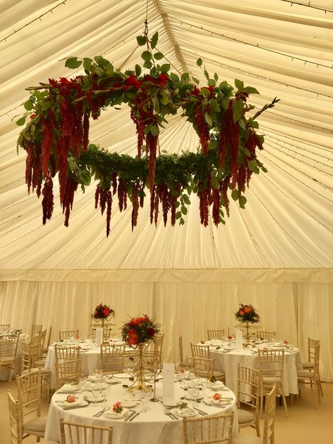 Hanging flowers at this Indian wedding at Sezincote in The Cotswolds. These hanging hoops look amazing in marquee weddings. This one features trailing red amaranthus. Red Hanging Flowers, Red Wisteria Wedding, Wedding Hanging Wreath, Hanging Amaranthus Installation, Hanging Amaranthus Wedding, Hanging Florals Wedding, Amaranthus Wedding, Garden Hanging Plants, Wedding Hanging Flowers