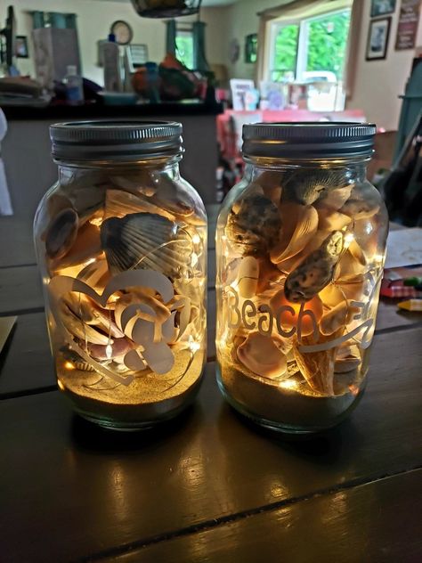 Sand And Seashell Display, Seashell Jar Display, Ways To Store Seashells, Sand And Seashells Ideas, Shells In Jars Display, Seashell Crafts Night Lights, Sand And Seashells In Jar, Fairy Light Jars Diy, Beach Jars Diy Ideas