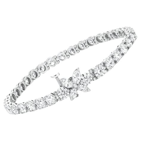 authentic Tiffany diamond bracelet is substantial and absolutely fantastic quality! A diamond tennis bracelet is a time tested look that will always be in style! The bracelet is part of the Tiffany Victoria line and retails for $46,000! Highlights: - 6.22 carats of diamonds for fantastic, substantial sparkle! - The diamonds are very high quality, bright white and exceptionally clean, graded F-G VS - Excellent cut round brilliants for fantastic brilliance and sparkle - Marquise diamonds on the cl Tiffany Tennis Bracelet, Tennis Bracelet Diamond Tiffany, Tiffany Victoria, Tiffany And Co Bracelet, Tiffany And Co Jewelry, Tiffany Diamond, Tiffany Bracelets, Antique Bracelets, Tiffany Jewelry