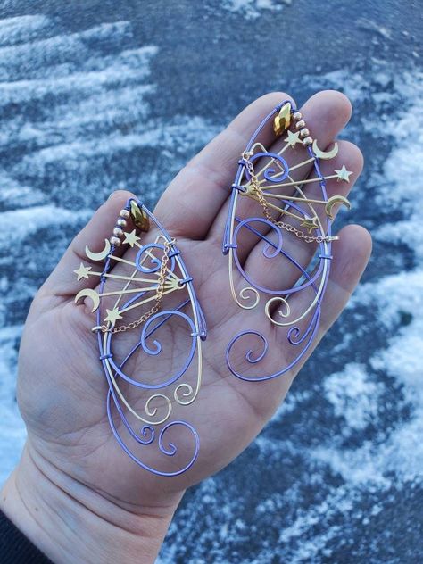 Moon and Stars Lavender, Gold COLOR You will receive a right and a left with this order. This is made to order in 3 to 5 business days of purchase. Elf ear cuffs are lightweight, stylish and one size fits all. You'll find a pair that is suitable for any event be at the Renaissance Fair, a fairy festival, or just a fun night out on the town! All Elf Ear Cuffs are made with artistic wire, silver plated non-tarnish copper, Nickel free. All Cuffs come as a set and easily fit any size ear by gently a Star Fairy Costume, Moon Elf Costume, Celestial Fairy Costume, Moon Fairy Costume, Elf Aesthetic Outfit, Fairy Elf Costume, Fairytale Accessories, Celestial Fairy, Star Fairy