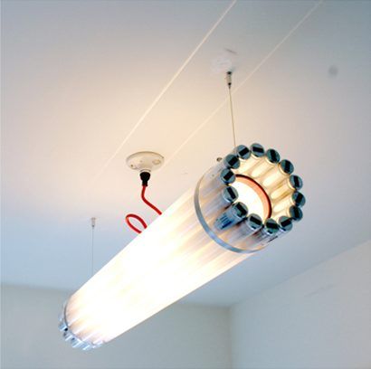 Light made from recycled ﬂuorescent tubes, powder coated steel and stainless steel banding and cable. Blitz Design, Fluorescent Tube Light, Lampe Diy, Tube Lamp, Linear Pendant Light, Pendant Light Design, Fluorescent Tube, Tube Light, Lampe Design