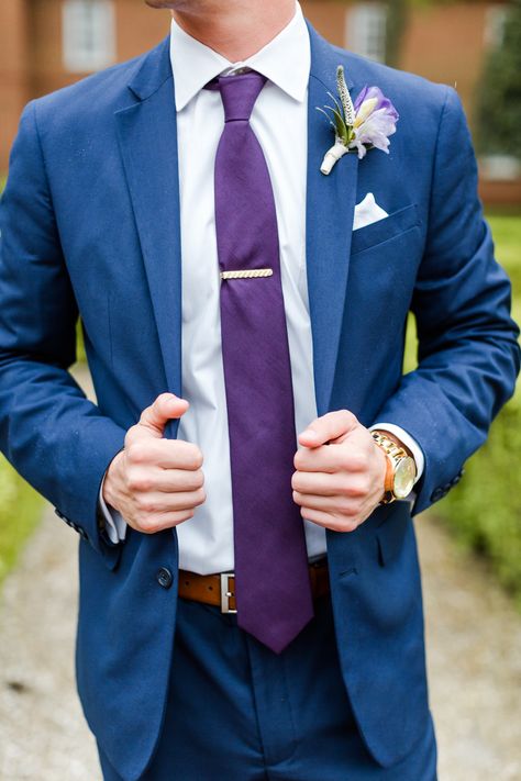 Suit: Mens Wearhouse  Tie: Mens Wearhouse  Belt: Mens Wearhouse Watch: Zumiez Florals: Gabriela Creations  #groom #groomsuit #weddingsuit #navyand purple wedding #bluesuits #wedding #weddingday #rainydaywedding #groomsmen Blue And Purple Groom Suit, Blue And Purple Suit Men, Navy Suit With Purple Tie, Purple And Blue Suit, Navy Blue Suit Purple Tie, Blue Suit Purple Tie Wedding, Blue And Purple Tuxedo Wedding, Blue And Purple Groomsmen Attire, Tangled Wedding Groom