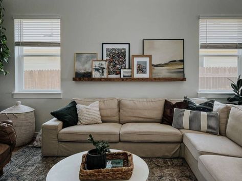 How to Style a Picture Ledge – Love & Renovations Picture Ledge Over Couch, How To Style A Picture Ledge, Picture Shelf Above Sofa, Living Room Floating Shelves Above Couch, Ledge Above Bed, Framing Puzzles, Picture Ledge Above Couch, Style A Picture Ledge, Frame A Puzzle