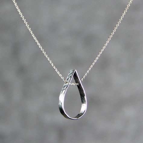 This simple teardrop pendant necklace is handmade and hand stamped using sterling silver. Slim, sheer, barely-there pendant for everyday wear. I've hand-hammered these shiny sequin dangles texture to give them a bit of sparkle. The teardrop stands for the inresistable natural gravitational force. It implies the softness of water. It is gravitating, playful and feminine. ;-) My contact number: 626-379-1904. Please contact me if you would like to order multiples or customize a design for your spec Gravitational Force, Silver Necklace Designs, Handmade Jewelry Necklace, Silver Jewelry Design, Wedding Gifts For Bridesmaids, Spiral Earrings, Gold Filled Earrings, Teardrop Pendant, Silver Jewelry Handmade