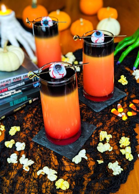 Dusk Til Dawn, the Perfect Halloween Cocktail. Great for parties because they're so easy to make in big batches for a crowd, this is the recipe you need this season. Using black vodka, this drink layers for a spooky effect. It's also got red and orange, evoking the colours of Halloween. It can also be made as a shot. Spooky Drink Ideas, Hocus Pocus Drinking Game, Halloween Recipes Drinks, Orange Juice And Vodka, Halloween Party Drinks, Pumpkin Beer, Image Halloween, Halloween Cocktails, Halloween Drinks