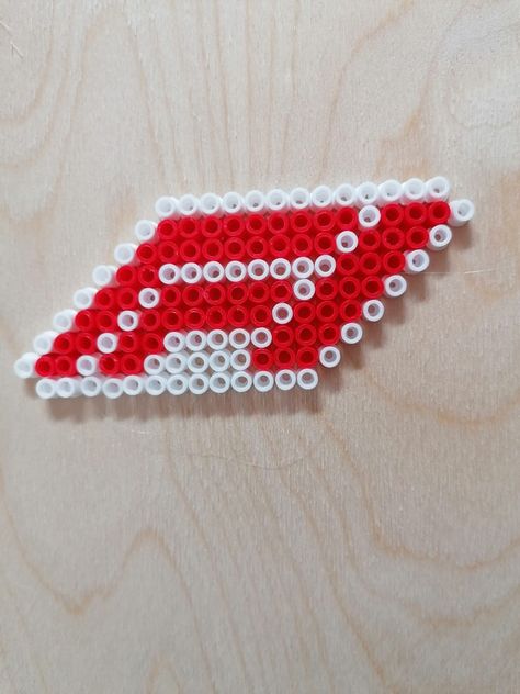 This is the official formula 1 logo made with Iron on beads. Red Bull Perler Beads, Formula 1 Crafts, F1 Perler Beads, Formula 1 Perler Beads, F1 Diy Ideas, F1 Pixel Art, Iron On Beads Ideas, F1 Crafts, Logo Perler Beads