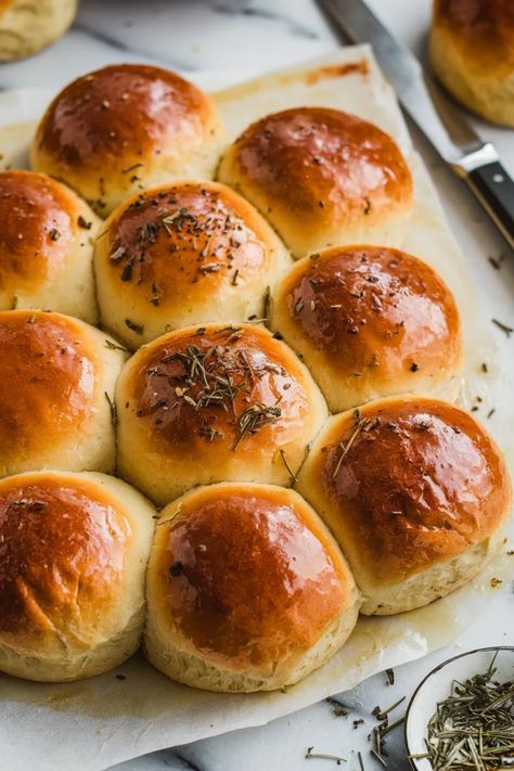 A photo of a  Garlic and Herb Dinner Rolls a make ahead thanksgiving recipes Best Rolls For Thanksgiving Dinner, Rolls Thanksgiving Dinner, Thanksgiving Rolls Make Ahead, Thanksgiving Meal Aesthetic, Thanksgiving Recipes Rolls, Thanksgiving Make Ahead, Easy Thanksgiving Rolls, Thanksgiving Alternative Meals, Friendsgiving Meal Ideas