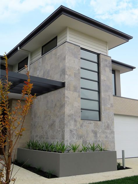 The Silver colour comes with a natural tumbled and unfilled finish to the stone, it look fantastic as a feature wall. Famously used by Watersun Homes and St Kilda Football club, applied externally to the house facade as an innovative new look that creates great curb appeal. One of the most enduring & sought after stones for flooring, wall tiles and paving in Australia. Can use internally & externally. DecoR Stone Quality Product Outdoor Wall Tiles Design House, Front House Wall Tiles Design, Facade Tiles Design, House Exterior Tiles, Marble Facade House, House Exterior Tiles Wall, Exterior Tiles Wall, External Wall Design, Home Front Wall Tiles Design