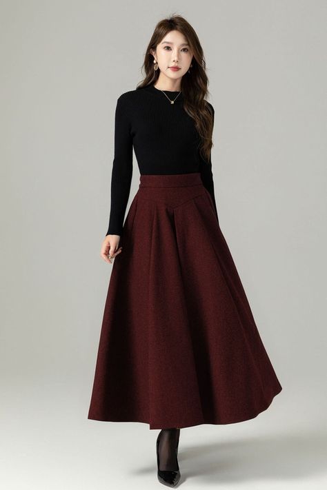 Fluidity and elegance from this chic winter skirt. Team the wool skirt with a chunky sweater, winter boots and an over sized handbag and you're good to go, no matter what the weather throws at you!  DETAIL * 30% wool, 30% fiber, 40% polyester * polyester lining * Two side Seam pockets * Back zipper closure, Back elastic make it more comfortable when wear * Ankle length effect * A Line maxi skirt * Dry clean *  Lean More about the items From the FAQs on the page bottom MODEL SIZE Bust 85 cm(33.4" Winter Skirts And Dresses, Big Sweater With Skirt, How To Style Long Skirts In Winter, Velvet Skirt Outfit Winter, Winter Long Skirt, Long Skirt Winter, A Line Maxi Skirt, Maxi Skirt Winter, Long Wool Skirt