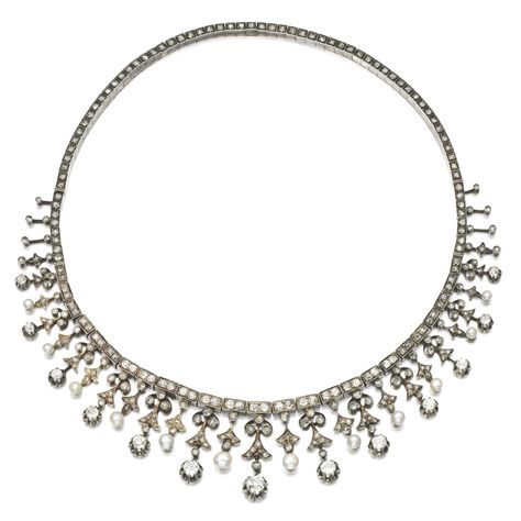 SEED PEARL AND DIAMOND NECKLACE/ BRACELET/ TIARA, LATE 19TH CENTURY Suspending a graduated fringe of foliate motifs set with seed pearls, circular-cut, cushion-shaped and rose diamonds, central fringe detachable and can be worn on accompanying tiara frame, reverse of necklace can be worn as a bracelet, French import marks, fitted case stamped B. Noury. Graduated Fringe, Bridal Accessory, Pearl And Diamond Necklace, Diamond Tiara, Head Jewelry, Diamond Jewelry Designs, Seed Pearl, Royal Jewelry, Royal Jewels