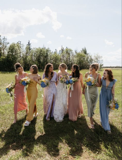 muted pastel bridesmaids dresses for a vintage garden party wedding Spring Garden Wedding Bridesmaids, Summer Garden Wedding Bridesmaids, Non Matching Bridal Party, Whimsical Wedding Bridesmaids, Summer Garden Party Color Palette, Wildflower Bridesmaids Dresses, Muted Pastel Bridesmaid Dresses, Muted Pastels Wedding, Mismatched Bridesmaid Dresses Spring Pastel Colors