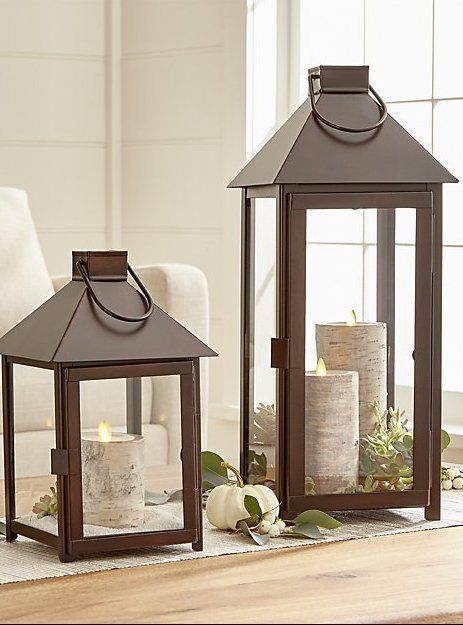 The traditional lantern scales up and streamlines with a warm bronze finish that looks great in the home or outside on the patio. Clean and classic styling includes glass panels, a hinged door, and hanging handle. Pair the coordinating lanterns together for a multi-level approach to candlelight. #homedecor #candles #lanterns #ad Decorating With Lanterns Indoors, Floor Lanterns Decor, Lantern Decor Living, Floor Lanterns, Outdoor Candle Lanterns, Floor Lantern, Traditional Lanterns, Modern Candle Holders, Living Room Decor Fireplace