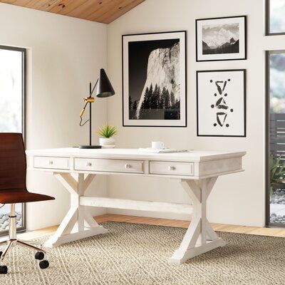 Whether you’re setting up your home office or searching for the perfect DIY space, this desk offers ample space to spread out *and* opportunities for out-of-sight storage as well. Crafted from solid rubberwood, the top of this writing desk strikes a rectangular silhouette that’s set on a canyon base. Offering 2 small drawers on either side of the center keyboard tray, each of the 3 is set on full-extension ball-bearing drawer glides for soft opens and closes. Plus, it comes complete with cable m Wooden Study Table, Solid Wood Writing Desk, Wood Writing, Modern Office Interiors, Desk Wood, Office Room Decor, Solid Wood Desk, Wayfair Furniture, White Desks