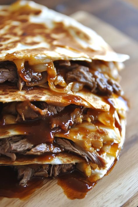 Combine the savory goodness of a classic Philly cheesesteak with the crispy delight of a quesadilla. Tender slices of steak, melted cheese, and sautéed peppers and onions are folded into a golden tortilla for a mouthwatering fusion meal. #CheesesteakQuesadilla #FusionCuisine #EasyDinner Philly Steak Quesadilla, Philly Steak And Cheese Omelet, Cheesesteak Quesadilla Recipes, Philly Cheese Steak Quesadilla, Cheese Steak Quesadillas, Steak Quesadilla Recipes, Sautéed Peppers, Steak Quesadillas, Steak Quesadilla