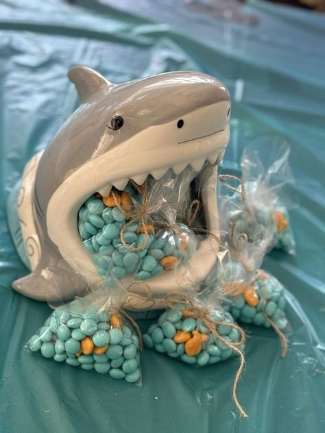 Shark Week All Year Long | My shark from Oriental Trading Company holding “fishbowls” for my grandkids | Facebook Shark Birthday Party Centerpieces, Sharks Birthday Party Ideas, Shark Birthday Activities, Shark Decorations Party, Shark Centerpiece Ideas, Shark Birthday Party Decorations, Shark Party Favors, Shark Week Party, Pet Shark