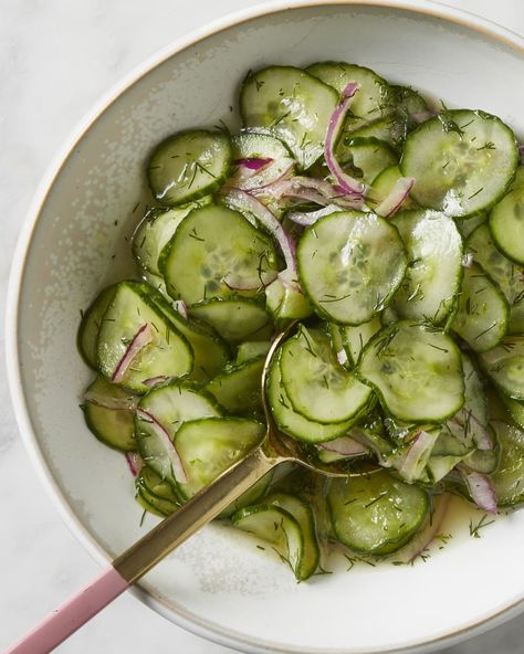 A bowl of cucumber onion salad on a marble surface with a pink-handled spoon reaching in for a scoop. Cucumber Onion Salad, Cucumber Onion, Pickled Cucumber, Recipes Salads, Grilled Prawns, Super Salads, Types Of Salad, Cucumbers And Onions, Onion Salad