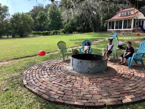 Circular red brick patio with fire pit Brick Fire Pit Patio, Red Brick Fire Pit, Circular Patio With Fire Pit, Half Circle Fire Pit Seating Area, Red Brick Patio, Circle Concrete Patio With Fire Pit, Circle Paver Patio With Fire Pit, Circular Brick Fire Pit, Circle Brick Patio Fire Pits