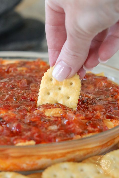 Pepper Jelly Cheese Dip is a warm appetizer served with butter crackers! This easy appetizer recipe uses simple ingredients that have the best flavor when combined. Hot Jelly Cream Cheese Dip, Valentine Party Dips, Red Pepper Jelly Dip Appetizer Recipes, Hot Pepper Jelly Cream Cheese Dip, Valentines Recipes Appetizers, Jalapeno Jelly Dip, Dip Party Theme, Whipped Boursin And Pepper Jelly Dip, Hot Pepper Jelly Cheese Dip