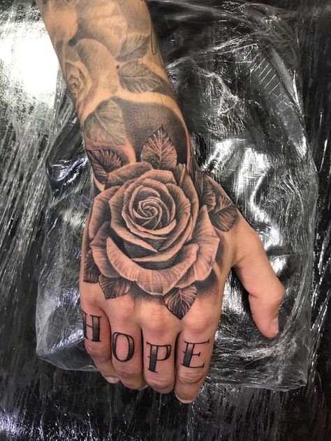 Tattoo Rose On Hand, Hand Rose Tattoos For Guys, Roses Tattoo Hand, Rose Tattoo Design On Hand, Rose Tattoo On The Hand, Men Hand Rose Tattoo, Manly Hand Tattoos, Rose Hand Tattoo Men Design, Hand Roses Tattoo