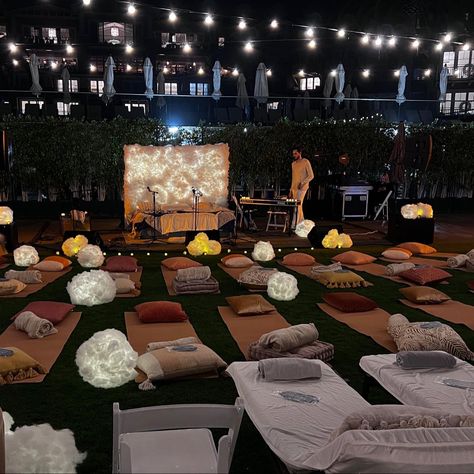 An outdoor evening concert with a bed as a stage and a keyboard on the side, surrounded by yoga mats, blankets, pillows and handmade lanterns that look like clouds. Yoga Event Ideas, Faux Clouds, Rest Ideas, Yoga Event, Lullaby Club, Wellness Event, Night Yoga, Diy Lantern, Brunch Event