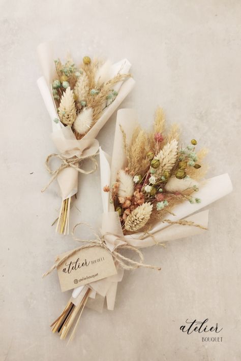 Surprise and delight your wedding guests with these charming dried mini bouquets, perfect for gifting as a heartfelt thank-you. One bouquet is slightly larger than the other and features delicate white and pink flowers. The other is a smaller version, perfect for holding and admiring up close. Each bouquet is made with attention to detail that matches your wedding colors. These timeless bouquets are sure to delight all of your guests, and serve as a cherished reminder of your special day." Dried Flower Wedding Favor, Single Dried Flower Bouquet, Mini Dried Flower Bouquet Diy, Small Dry Flower Bouquet, Mini Dried Bouquet, Dried Flowers Ideas Bouquet, Dried Flowers Bouquet Gift, Dried Flowers Gift Ideas, Dried Flower Boquet