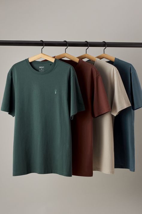 Refresh your essentials with this multipack of casual T-Shirts. With a classic crew neckline and short sleeves, they're finished with our signature stag at the chest. 4 x T-shirt 100% Cotton. Discover the must-have outfit clothing pieces for your wardrobe this season! This guide is packed with trendy picks that will elevate your style game. Don’t miss out on the hottest items that every fashion lover should own this year! 🌟 #fashion #style #outfitclothing #trend #wardrobeessentials Best T Shirts Men, Tshirt Hanging Ideas, Best T Shirt For Men, Aesthetic T Shirts Men, T Shirt Brand Photoshoot, New T Shirt Designs For Men, Cloth Photoshoot Ideas, Mens T-shirt, Mens Tshirt Outfit Casual