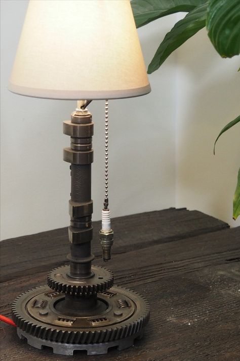 Industrial lamp handcrafted from upcycled motorcycle parts, by Lacour Motorcycles Motor Parts Shop Design, Car Parts Lamp, Motorcycle Decor Interior Design, Car Part Lamp, Motorcycle Bedroom, Car Part Art, Car Parts Decor, Man Cave Lighting, Old Car Parts