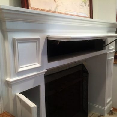 This fireplace mantel has tons of secret storage spots. So cool Storage Fireplace, Tv Over Fireplace, Fireplace Diy, Fireplace Built Ins, The Mantle, Flat Screen Tv, Faux Fireplace, Fireplace Remodel, Wood Fireplace