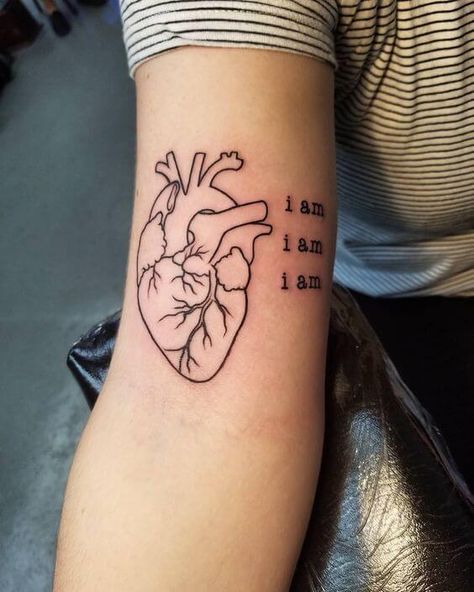 This is a wonderfully simple tattoo that can be perfect to instill self-belief in girls. The words “I am” iterated three times can act as a great motivational tool while the heart itself is subtly beautiful and is able to achieve a lot without taking up too much space. #tattoofriday #tattoos #tattooart #tattoodesign #tattooidea Real Heart Tattoos, Hand Heart Tattoo, Human Heart Tattoo, Realistic Heart Tattoo, Anatomical Tattoos, Anatomy Tattoo, Red Heart Tattoos, Tato Dengan Makna, Anatomical Heart Tattoo