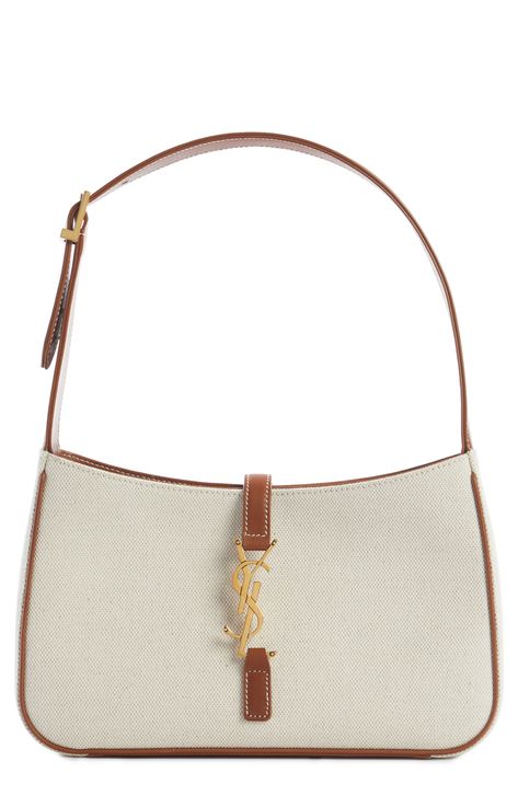 A slim, structured silhouette ensures this canvas bag fits perfectly under the arm. Hook tab closure Adjustable shoulder strap Structured silhouette with flat base for stability Textile with leather trim Made in Italy Designer Handbags Canvas Shoulder Bags For Women, Designer Items Aesthetic, Designer Staple Pieces, Designer Hand Bags, Cute Designer Bags, Trendy Designer Bags, Cute Shoulder Bags, Pretty Handbags, Classy Bags