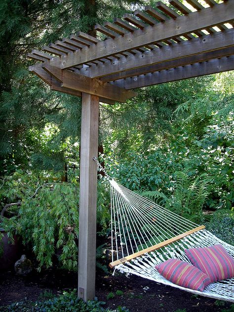 I wonder if I could grow wisteria on the arbor... If I succeeded my hammock would probably be infested with bees... Wisteria Trellis, Fire Pit Pergola, Pergola Diy, Backyard Hammock, Cheap Pergola, Patio Pergola, Backyard Garden Landscape, Cozy Backyard, Backyard Gazebo