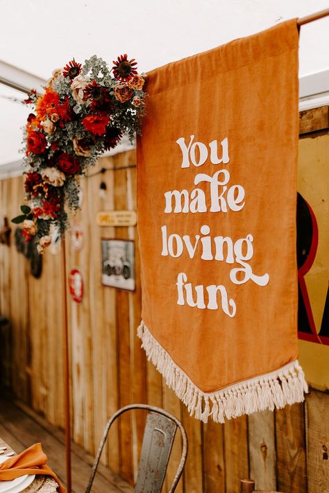 Orange Table Decor Banner Sign Boho Retro 70s Daisy Jones Six Wedding Ideas Caroline Opacic Photography #wedding #weddingdecor 70s Inspired Fall Wedding, 70s Fall Wedding, 1970s Wedding Decor, Retro Rustic Wedding, Retro Wedding Arch, Fall Retro Wedding, 70's Wedding Inspiration, Stevie Nicks Wedding Theme, 70’s Wedding Aesthetic