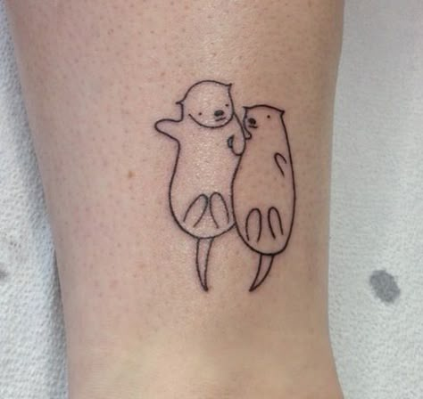 small sea otter tattoo | Otters holding hands Holding Hands Tattoo, Hase Tattoos, Otter Tattoo, Otters Holding Hands, Hands Tattoo, Matching Best Friend Tattoos, Cat Tattoo Designs, Hold Hands, Poke Tattoo