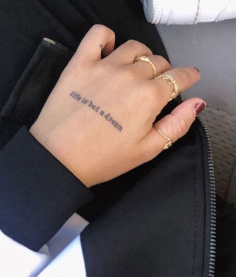 Words Hand Tattoos For Women, Phrase Hand Tattoo, Life Is But A Dream Tattoo, Words Hand Tattoo, Hand Text Tattoo, Word Hand Tattoos, Tattoo Sentences, Dna Tattoo, Believe Tattoos