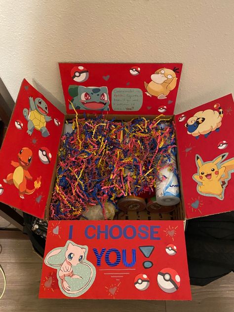 Pokemon Box Valentines Day, Pokemon Box Ideas, Pokemon Box Diy, Pokemon Care Package, Anime Gift Basket Ideas, Pokemon Anniversary Gift, Pokemon Basket Ideas, Diy Pokemon Valentines Boxes, Pikachu Gift Ideas