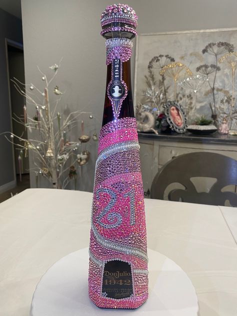 At Karine's Krystals, I am able to customize any alcoholic bottles to meet your specific desires and preferences. Whether it's a centerpiece for your most elegant gatherings or a cherished gift for those who appreciate the finer things in life, our bedazzled alcoholic bottle stands as a symbol of refined taste and unparalleled luxury. Bedazzled 1942 Bottle, Don Julio 1942 Bottle Decorated, Bedazzled Alcohol Bottle, Custom Alcohol Bottles, Bedazzled Flask, Bedazzled Bottles, Bejeweled Bottles, Bedazzled Things, Blinged Bottles