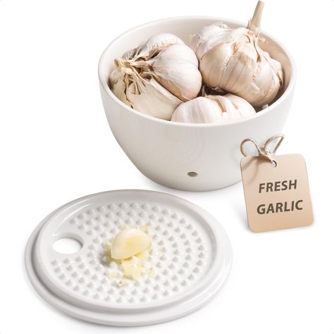 PRICES MAY VARY. Our Ceramic Garlic Keeper measures 5.12" L x 2.95" H, providing ample space to store up to three normal-sized garlic bulbs. The wide opening ensures easy access while maintaining an elegant presentation on your countertop. 6 vents around the garlic saver maximize airflow, keeping garlic dry. The ceramic lid blocks out light, extending shelf life of your garlic and reducing sprouting. Made of premium porcelain, our garlic holder is crafted for durability. It resists odor absorpti Clay Garlic Keeper, Garlic Grater Pottery, Garlic Holder, Garlic Grater Plate, Creative Pottery, Garlic Tool, Cement Ideas, Ginger Grater, Garlic Keeper