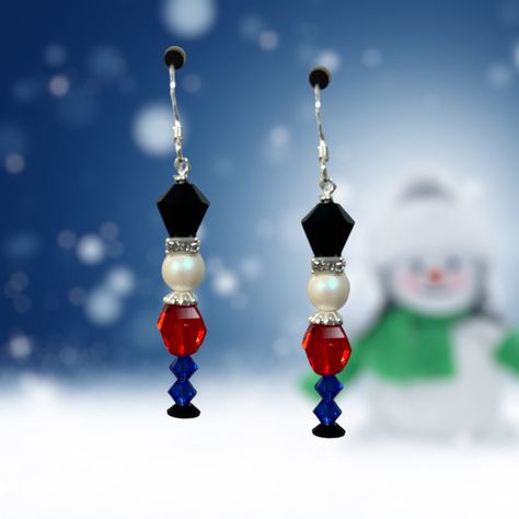 Limited Edition DIY Jewelry Kit - Nutcracker Earring by Toocutebeads.com Ignite your festive spirit with our Nutcracker Earring DIY Jewelry Making Kit. This limited-edition kit allows you to create your own unique pair of Christmas earrings, combining vintage Swarovski crystals with sterling silver. The result? A captivating pair of earrings that embody the joy and charm of the holiday season. Key Features & Benefits: Limited Edition: As part of a unique, limited edition series, this kit provide Beaded Snowman Earrings Diy, Nutcracker Beaded Earrings, Christmas Charm Earrings, Holiday Earring Ideas, Christmas Diy Jewelry Ideas, Beaded Jewelry Christmas, Diy Christmas Earrings Ideas, Beaded Christmas Jewelry, Christmas Necklace Diy