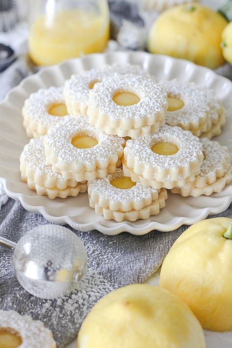 Lemon Curd Linzer Cookies - Baking with Blondie Lemon Cookies With Lemon Cream Filling, Lemon Linzer Cookies, Lemon Icebox Cookies, Lintz Cookies, Solstice Cookies, Cream Cheese Cookies Recipes, Cookies With Lemon Curd, Lemon Sandwich Cookies, Cookie Tables