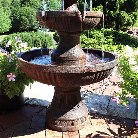 Brown oudoor tiered electric water fountain with flower blossom top Features fiberglass and resin construction Includes 3-tier fountain, electric submersible pump Cover or store before freezing weather occurs Dimensions: 25" diameter x 43" H; 40 lbs Add elegance and charm to any outdoor space with this tiered electric water fountain. Whether placed in a garden, on a deck, patio, or porch the ample size and beauty of this piece will be sure to make a statement. As a bonus, the soothing sounds of Fountain Centerpiece, Outdoor Electrical Outlet, Fiberglass Resin, Bird Bath Fountain, Tabletop Fountain, Waterfalls Backyard, Fountain Feature, Waterfall Features, Water Fountains Outdoor