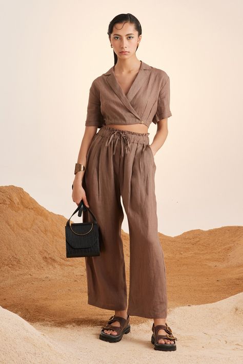 Light brown pant in a linen base with drawstring tie up at the waist and pockets on the side. Components: 1 Fabric: Linen Color: Brown Other Details:  Patch pockets at the back Tie up at the waist Note: The crop top worn and bag carried by the model is not for sale Occasion: Resort - Aza Fashions Brown Linen Pants, Linen Wrap Top, Crop Top And Pants Set, Crop Top Pants Set, Maxi Pants, Refined Fashion, Linen Crop Top, Shirt Linen, Linen Pant