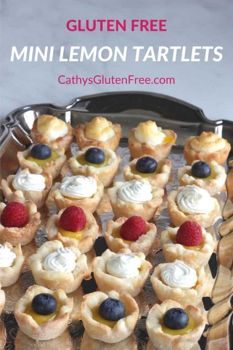 Mini Lemon Tartlets are beautiful little bites of flaky gluten free pie crust filled with lemon curd and topped with berries, whipped cream, or meringue. They're perfect for showers, Mother's Day, or an elegant Easter platter.